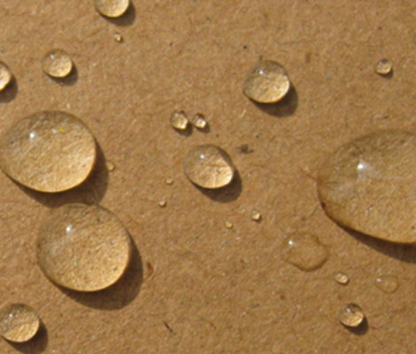 Image of water droplets on cardboard