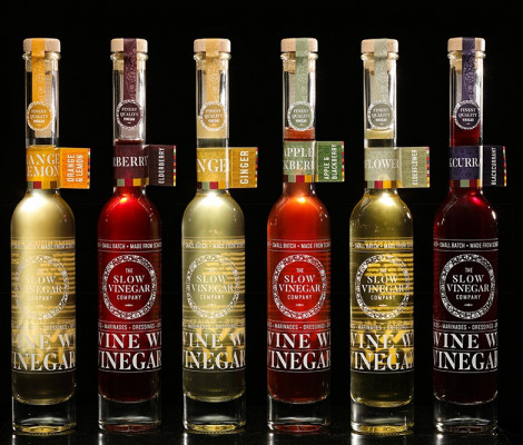 An image of a variety of bottles of flavours of vinegar made by The Slow Vinegar Company