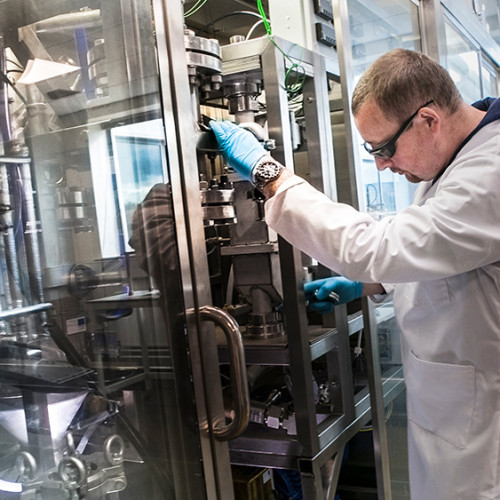 Image of scientist, Peter Hurst, working in a laboratory at the Biorenewables Development Centre