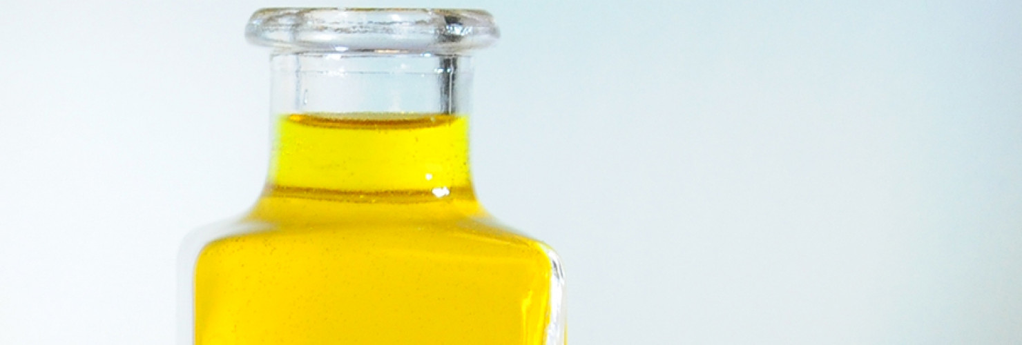 Image of oil in clear glass bottle