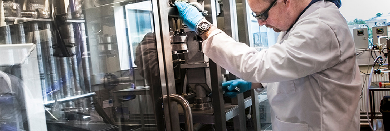 Image of scientist, Peter Hurst, working in a laboratory at the Biorenewables Development Centre