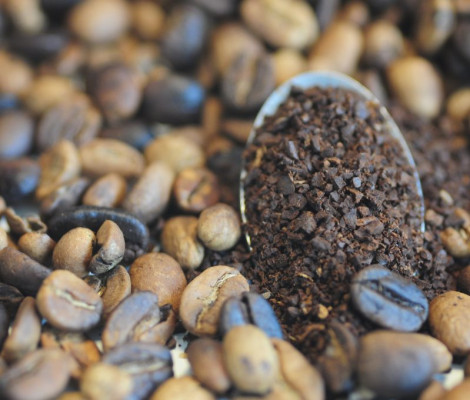 Image of ground coffee and coffee beans